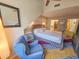 Bright bedroom with a comfortable bed and sitting chair at 226 Westleton Dr. # 19-D, Myrtle Beach, SC 29572