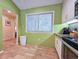 Bright kitchen with tile floors and green walls at 226 Westleton Dr. # 19-D, Myrtle Beach, SC 29572
