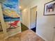 Hallway with beach-themed wall art and closet space at 226 Westleton Dr. # 19-D, Myrtle Beach, SC 29572