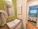 Bathroom with a white sink and green walls at 226 Westleton Dr. # 19-D, Myrtle Beach, SC 29572