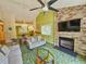 Bright living room with stone fireplace and green carpet at 226 Westleton Dr. # 19-D, Myrtle Beach, SC 29572