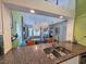 Kitchen with breakfast bar and view into living area at 226 Westleton Dr. # 19-D, Myrtle Beach, SC 29572