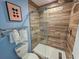 Walk-in shower with wood-look tile and glass enclosure at 226 Westleton Dr. # 19-D, Myrtle Beach, SC 29572
