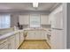 White kitchen with ample counter space and appliances at 800 Crumpet Ct. # 1122, Myrtle Beach, SC 29579