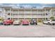 Three-story building exterior with ample parking at 800 Crumpet Ct. # 1122, Myrtle Beach, SC 29579