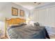 Bedroom with wooden bed frame and gray bedding at 800 Crumpet Ct. # 1122, Myrtle Beach, SC 29579