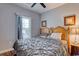 Bedroom with wooden bed frame and gray bedding at 800 Crumpet Ct. # 1122, Myrtle Beach, SC 29579