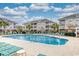 Community pool with plenty of lounge chairs at 800 Crumpet Ct. # 1122, Myrtle Beach, SC 29579