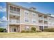 Three-story building with brick and siding exterior at 800 Crumpet Ct. # 1122, Myrtle Beach, SC 29579