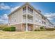 Three-story building with brick and siding exterior at 800 Crumpet Ct. # 1122, Myrtle Beach, SC 29579