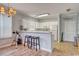 Open kitchen with white cabinets and breakfast bar at 800 Crumpet Ct. # 1122, Myrtle Beach, SC 29579