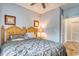 Bedroom with wooden bed frame and gray bedding at 800 Crumpet Ct. # 1122, Myrtle Beach, SC 29579