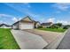 House exterior with driveway, attached garage, and lawn at 629 Swinford Dr., Myrtle Beach, SC 29588
