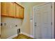 Laundry room with wooden cabinets and exterior access at 629 Swinford Dr., Myrtle Beach, SC 29588