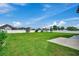 Large backyard with grassy area and a concrete patio at 629 Swinford Dr., Myrtle Beach, SC 29588