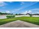 Spacious backyard with grassy lawn, raised garden, and white fence at 629 Swinford Dr., Myrtle Beach, SC 29588