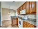 Kitchen boasts granite countertops, wood cabinets, and white appliances at 629 Swinford Dr., Myrtle Beach, SC 29588