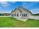 Tan house exterior with a grassy lawn and white fence at 629 Swinford Dr., Myrtle Beach, SC 29588