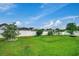 Landscaped backyard with young trees and grassy lawn at 629 Swinford Dr., Myrtle Beach, SC 29588