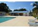 Community pool and clubhouse with lounge chairs at 1119 Blue Ridge Trail, North Myrtle Beach, SC 29582