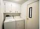 Small laundry room with washer and dryer hookups and additional storage at 1119 Blue Ridge Trail, North Myrtle Beach, SC 29582