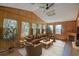 Relaxing sunroom with wood paneling, leather furniture, and fireplace at 1119 Blue Ridge Trail, North Myrtle Beach, SC 29582