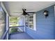 Covered front porch with ceiling fan and exterior lighting at 1119 Blue Ridge Trail, North Myrtle Beach, SC 29582