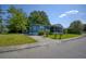 Blue house with a screened porch and landscaped yard at 1119 Blue Ridge Trail, North Myrtle Beach, SC 29582