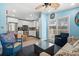 Living room with kitchen view, seating and a ceiling fan at 6001-1573 S Kings Hwy., Myrtle Beach, SC 29575
