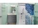Bathroom with a shower/tub combo, gray vanity, and white tile at 6001-1573 S Kings Hwy., Myrtle Beach, SC 29575
