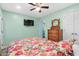 Bedroom with floral bedding, dresser, and access to another room at 6001-1573 S Kings Hwy., Myrtle Beach, SC 29575