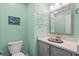 Small bathroom with toilet, sink, and decorative shelving at 6001-1573 S Kings Hwy., Myrtle Beach, SC 29575