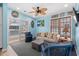 Living room with sliding door to deck, comfy seating and a ceiling fan at 6001-1573 S Kings Hwy., Myrtle Beach, SC 29575