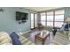 Relaxing living room with ocean view and comfortable seating at 523 S Ocean Blvd. S, North Myrtle Beach, SC 29582