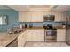 Updated kitchen with stainless steel appliances and granite countertops at 523 S Ocean Blvd. S, North Myrtle Beach, SC 29582