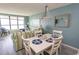 Bright dining area with white table and chairs, near living room and kitchen at 523 S Ocean Blvd. S, North Myrtle Beach, SC 29582