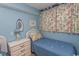 Bedroom with twin beds and beach decor at 523 S Ocean Blvd. S, North Myrtle Beach, SC 29582