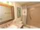 Bathroom with tub, shower, and granite vanity at 523 S Ocean Blvd. S, North Myrtle Beach, SC 29582