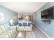 Bright living room with comfy sofas, a coffee table, and a large TV at 523 S Ocean Blvd. S, North Myrtle Beach, SC 29582