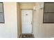 White front door with seashell welcome mat at 523 S Ocean Blvd. S, North Myrtle Beach, SC 29582