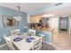Open concept dining area with kitchen and living room view at 523 S Ocean Blvd. S, North Myrtle Beach, SC 29582