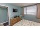 Bedroom with a queen bed, dresser, and TV at 523 S Ocean Blvd. S, North Myrtle Beach, SC 29582
