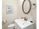 Simple bathroom with white vanity and oval mirror at 6001 S Kings Hwy., Myrtle Beach, SC 29575