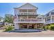 Two-story home with spacious deck and covered parking at 6001 S Kings Hwy., Myrtle Beach, SC 29575