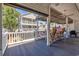 Relaxing deck with outdoor seating, overlooking backyard at 6001 S Kings Hwy., Myrtle Beach, SC 29575