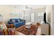 Relaxing living room with blue couch and access to outdoor space at 6001 S Kings Hwy., Myrtle Beach, SC 29575