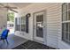 Enclosed front porch with seating and exterior door at 6001 S Kings Hwy., Myrtle Beach, SC 29575
