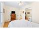 Bright bedroom with double bed, wood dresser, and large closet at 6001 S Kings Hwy., Myrtle Beach, SC 29575