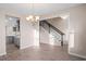 Dining room with hardwood floors, chandelier and view into kitchen at 1019 Gold Dew Way, Myrtle Beach, SC 29579