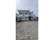 Charming two-story home with teal accents and paved driveway at 329 54Th Ave. N, North Myrtle Beach, SC 29582